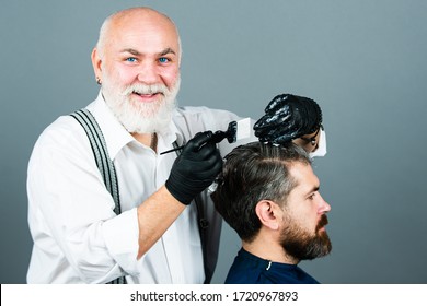 Process of a guy having his hair dyed at hairdresser. Hair coloring man agains grey hair. Professional senior hairdresser drying hair - Powered by Shutterstock