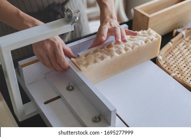 Process handmade soap. Woman cutting handmade soap. Prepare handmade soap for cure soap. Close up. Shampoo bar.