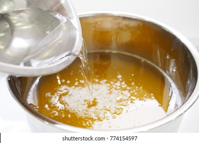 Process Of Homemade Soap, Mixing Lye Solution Into Oil