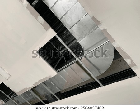 a process of HVAC ducting work above a ceiling