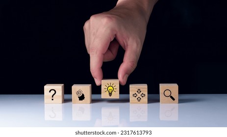 process of idea concept formation or creation and problem solving. Thinking, analyzing, research, information gathering and idea icons on wooden cubes.