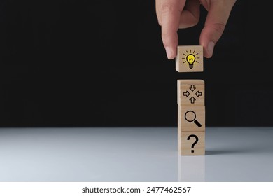 process of idea concept formation or creation and problem solving. Thinking, analyzing, research, information gathering and idea icons on wooden cubes.