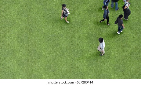 The Process Image Of Man And Women People Walk On Across Grass Greenfield Landscape Background In The Garden Park (Aerial Top View)