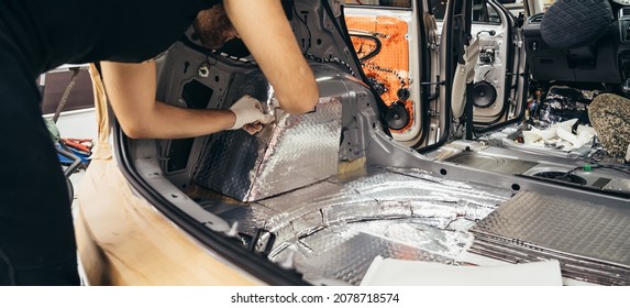 Process Of Installation Of Soundproofing Material To Inside Of Car. Auto Sound Insulation