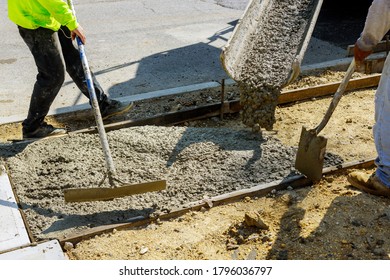 Process of installing construction of new sidewalks laying concrete cement