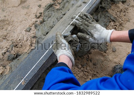 the process of installing the curb. curb on the street