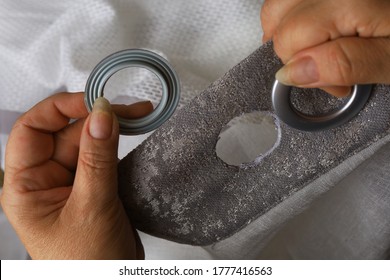 The process of installing eyelets on the curtains. The importance of small details in interior design.
