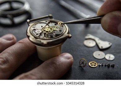 The process of installing a part on a mechanical watch, watch repair