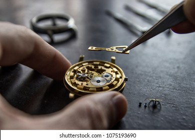 Process of installing a part on a mechanical watch, watch repair - Powered by Shutterstock