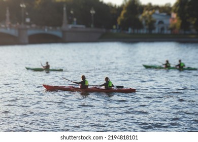 A process of kayaking in the city river canals, with colorful canoe kayak boat paddling, process of canoeing, group of kayaks, colorful canoe kayak boat paddling, summer sunny day