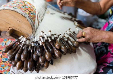 Process of lace-making with bobbins