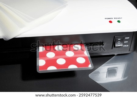 the process of laminating colored paper in a laminator