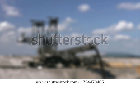 process loading coal mining from crusher to jetty conveyor.blurry background