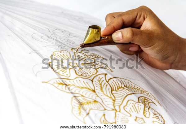 The process of making batik. Batik is a handmade\
ancient art from Indonesia. Produced by technique of wax-resist\
dyeing applied to fabric.