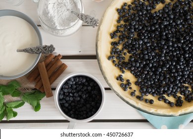 The Process Of Making Blueberry Pie. The Ingredients On A Wooden Table. Top View.