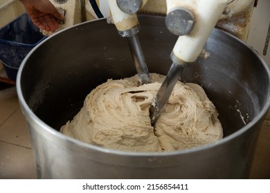 Process of making bread dough in industrial kneading machine in small bakery