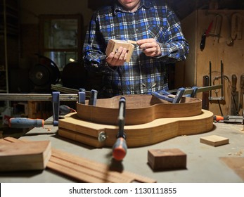 The Process Of Making A Classical Guitar. Adhering Tailblock And Neckblock Guitars.