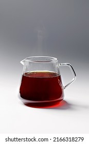 The Process Of Making Coffee In The Filter. Beautiful Coffee Pot And Glass Cup. White Background.