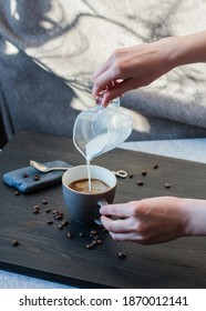 The process of making coffee, latte. The addition of milk.