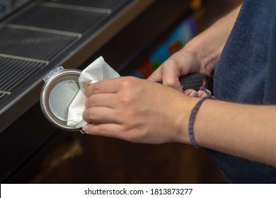 The Process Of Making Coffee On A Coffee Maker. Cleaning The Holder Before Use.