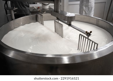 Process of making dairy products in modern dairy factory. Preparing milk for cheese, pasteurization in large tanks. Copy space - Shutterstock ID 2291916521