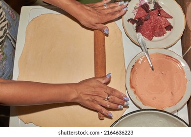 The Process Of Making Homemade Pizza In The Kitchen