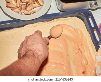 The Process Of Making Homemade Pizza In The Kitchen