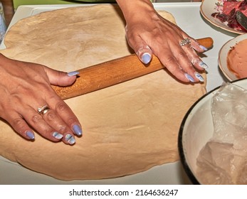 The Process Of Making Homemade Pizza In The Kitchen