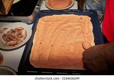 The Process Of Making Homemade Pizza In The Kitchen