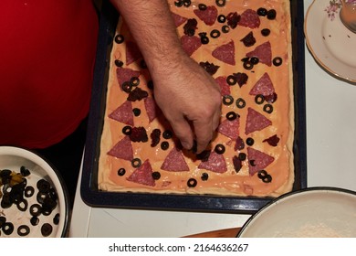 The Process Of Making Homemade Pizza In The Kitchen