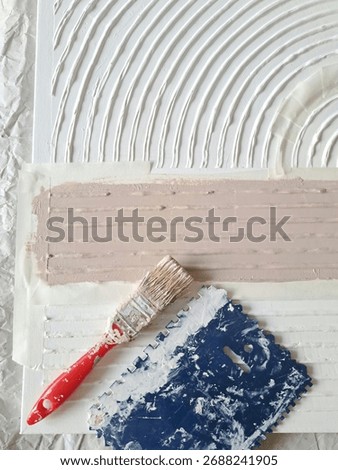 The process of making a painting from structural paste using art tools and paint brush