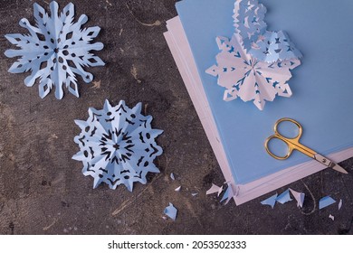 The Process Of Making Paper Snowflakes