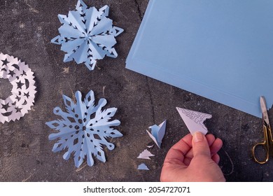 The Process Of Making Paper Snowflakes