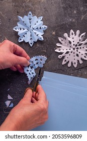 The Process Of Making Paper Snowflakes Flat Lay