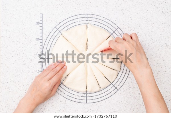 Process of making the pull apart bread. 2-Divide\
and roll the dough