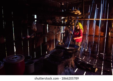 The Process Of Making Traditional Palm Sugar In A Smoky Kitchen, East Java 2 December 2020.