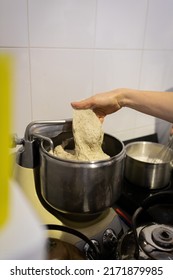 The Process Of Making Wheat Bread In An Artisan Bakery. Dough Kneading In A Dough Mixer. Vertical Photo.