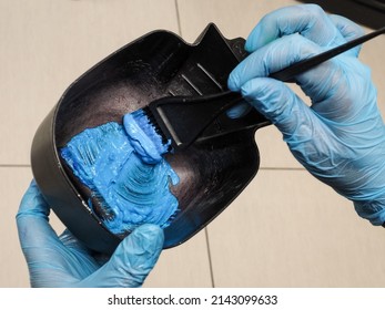 the process of mixing hair dye. bright colored hairstyle. industry of beauty and hair care, hair cutting, coloring, lightening, toning, restoration. - Powered by Shutterstock