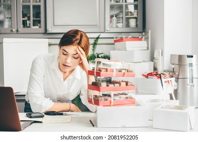 Process Of Packing Cookies Into A Cardboard Kraft Box. Woman Feeling Bored, Frustrated And Sleepy After Work. Small Business Owner. 