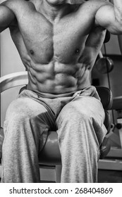 The process of physical exercise . The man is engaged in the gym. Training in the gym. Healthy lifestyle. Photo in creative.