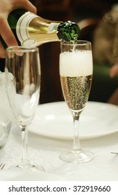 The Process Of Pouring Champagne Into A Glass