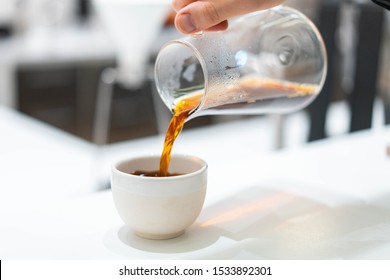 Process Of Preparation Black Coffee In Filter Pour Over Coffee Maker In Bright Modern Cafe. Alternative Ways Of Brewing Coffee. Stylish Image With Noise Or Grains.