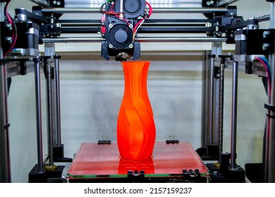 Process printing model on 3d printer. High tech digital printer computer machine in action. Printing mechanism adding layers to object. FDM 3d printer working at 3d printing lab. 3D modern technology.