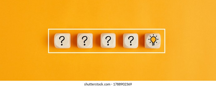 The process of problem solving or idea formation. Question mark and light bulb icons on wooden cubes on yellow background. - Shutterstock ID 1788902369