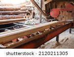The process of processing wood at an old sawmill. Timber industry