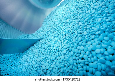 Process of production of pills, tablets. Industrial pharmaceutical concept. Factory equipment and machine. 