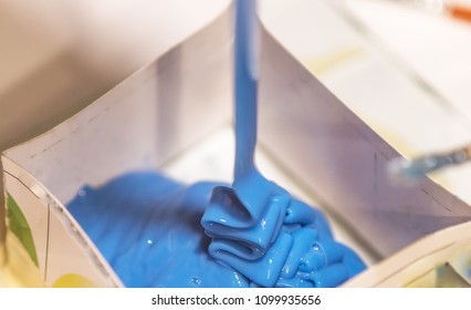 Process Of Putting Blue Liquid Silicone Rubber Into Mold Form For Making Copies