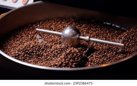 Process roasting coffee beans on professional mixing roaster machines.