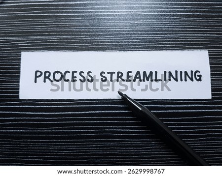 Process streamlining writting on table background.