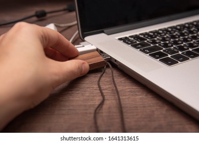 The process of transferring information through a flash drive to a laptop